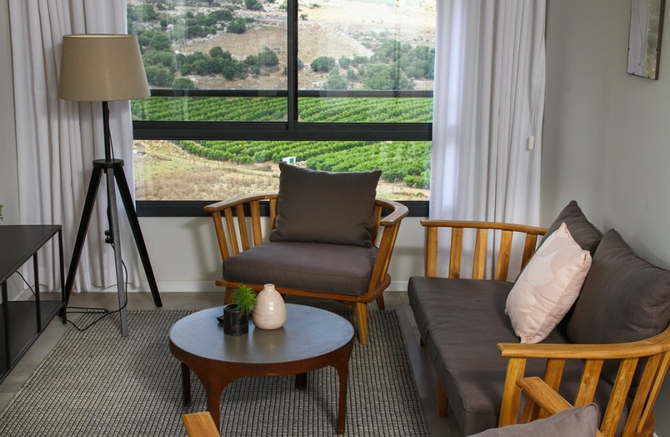 Seating corner by a window with a vineyard view