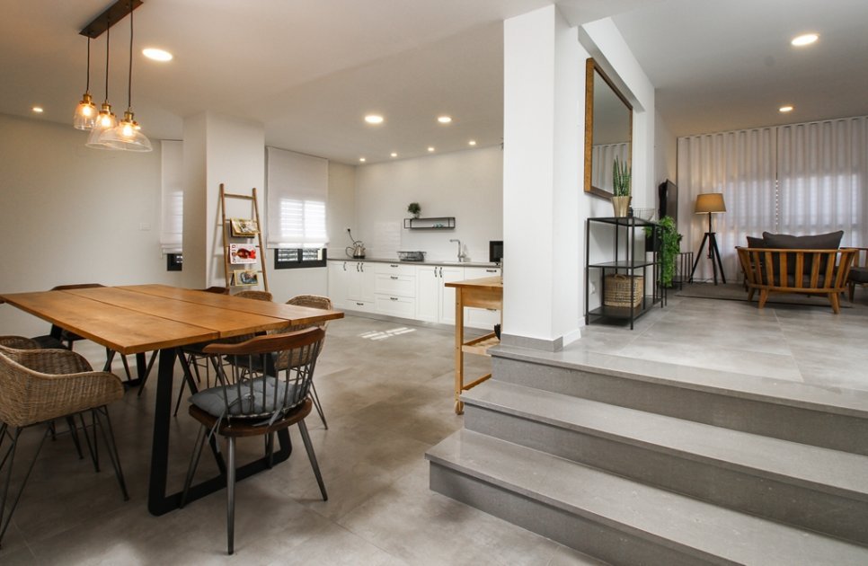 Kitchen, dining table and steps up to the lounge on floor 2